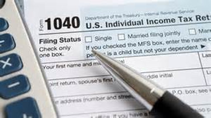 Can a spouse sign a tax return for someone else?