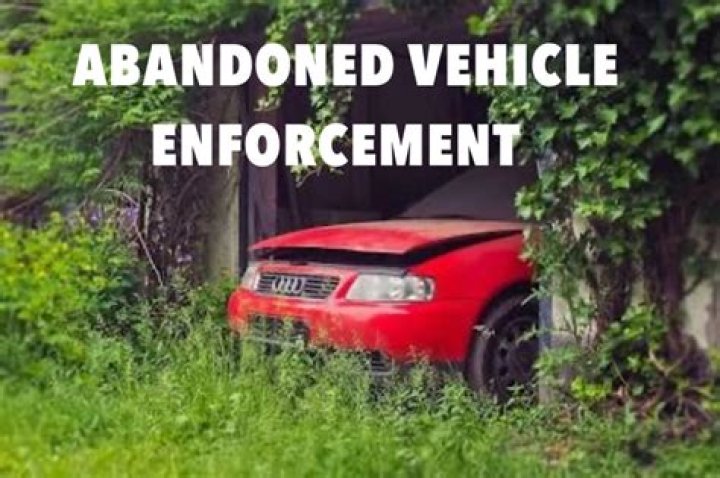 How do I remove an abandoned vehicle from private land?