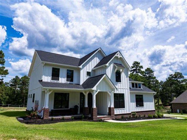 Is it better to buy a house on your own or with someone?