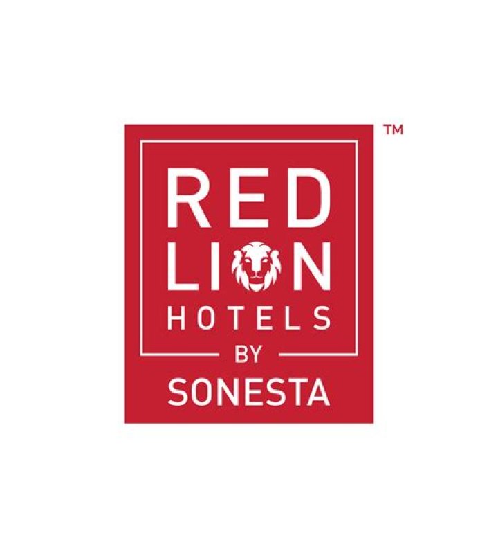 What company owns Red Lion Hotels?
