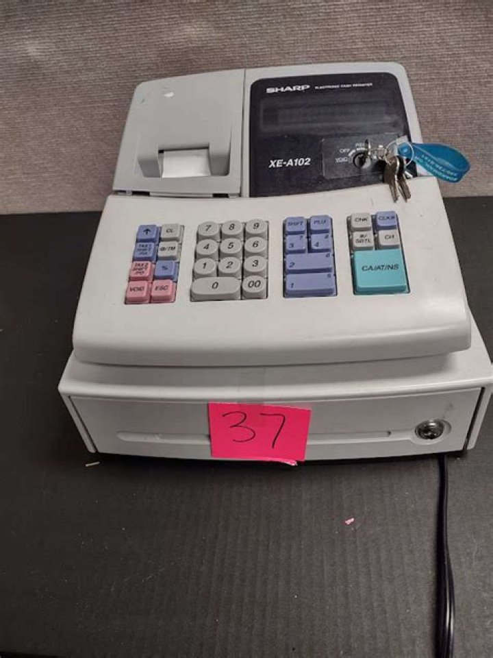 What does E32 mean on a sharp cash register?