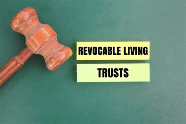 What happens to a revocable trust after a spouse dies?