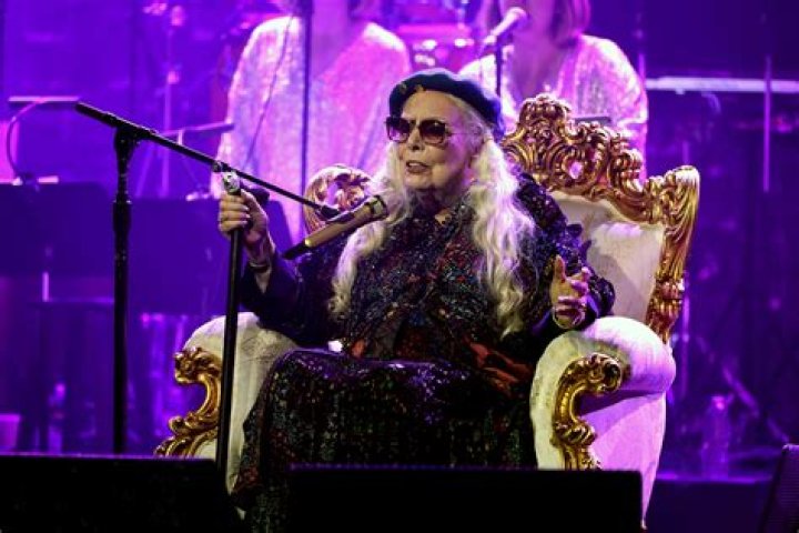 Who is Joni Mitchell singing about in help me?